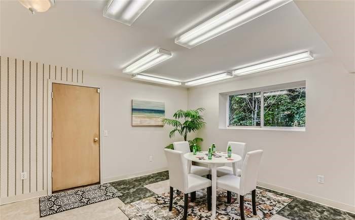 a room with a table and chairs