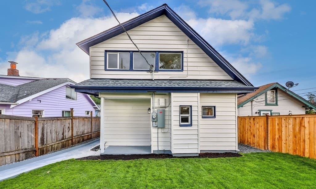 a house with a lawn and a fence