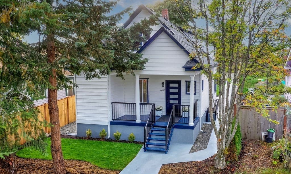 Exterior 2 Repaint After 6 a house with a porch and a walkway