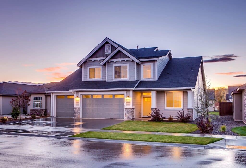 186077 scaled a house with a driveway and a driveway