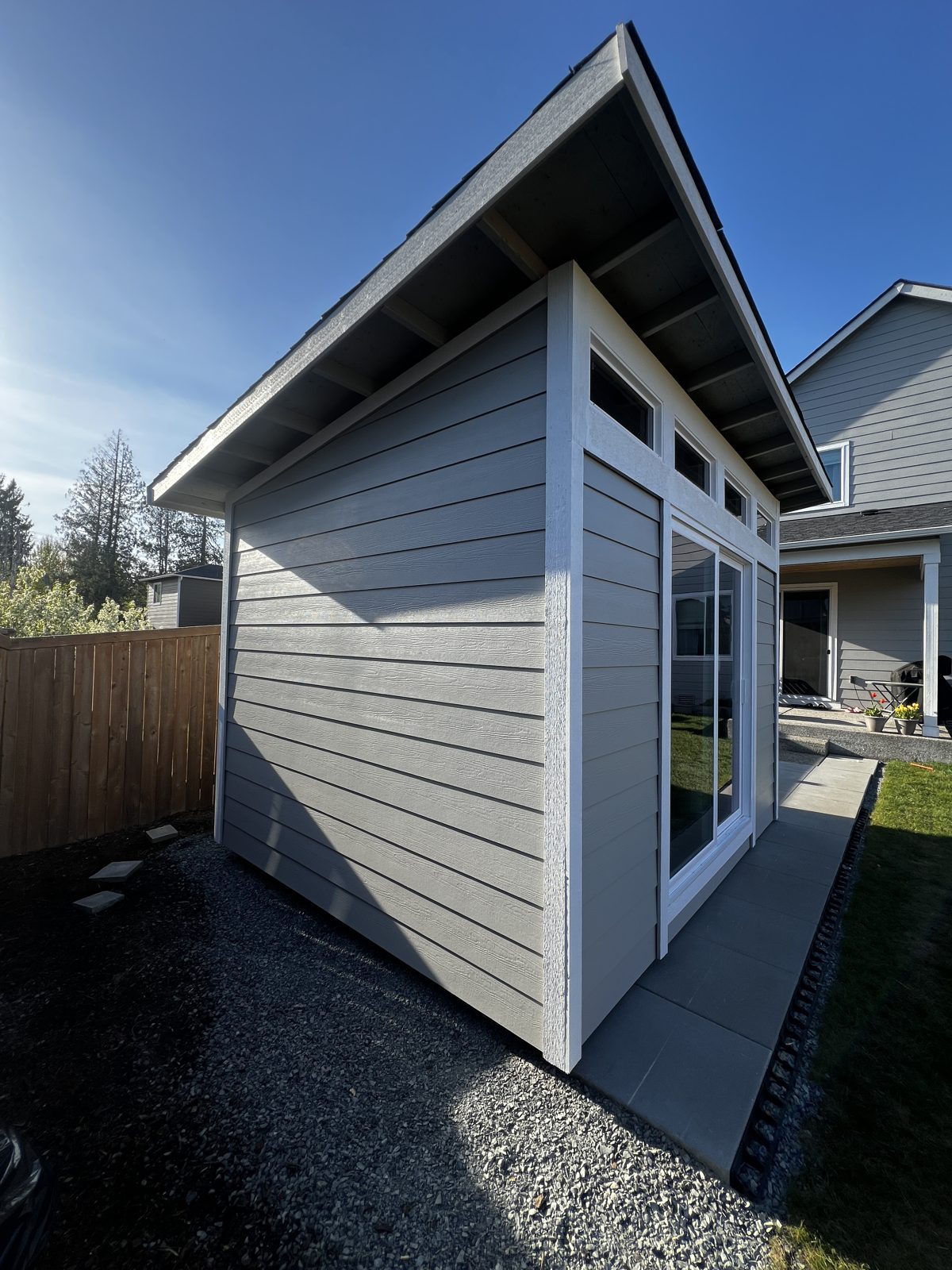 Side view of the painted Everett studio with transom windows