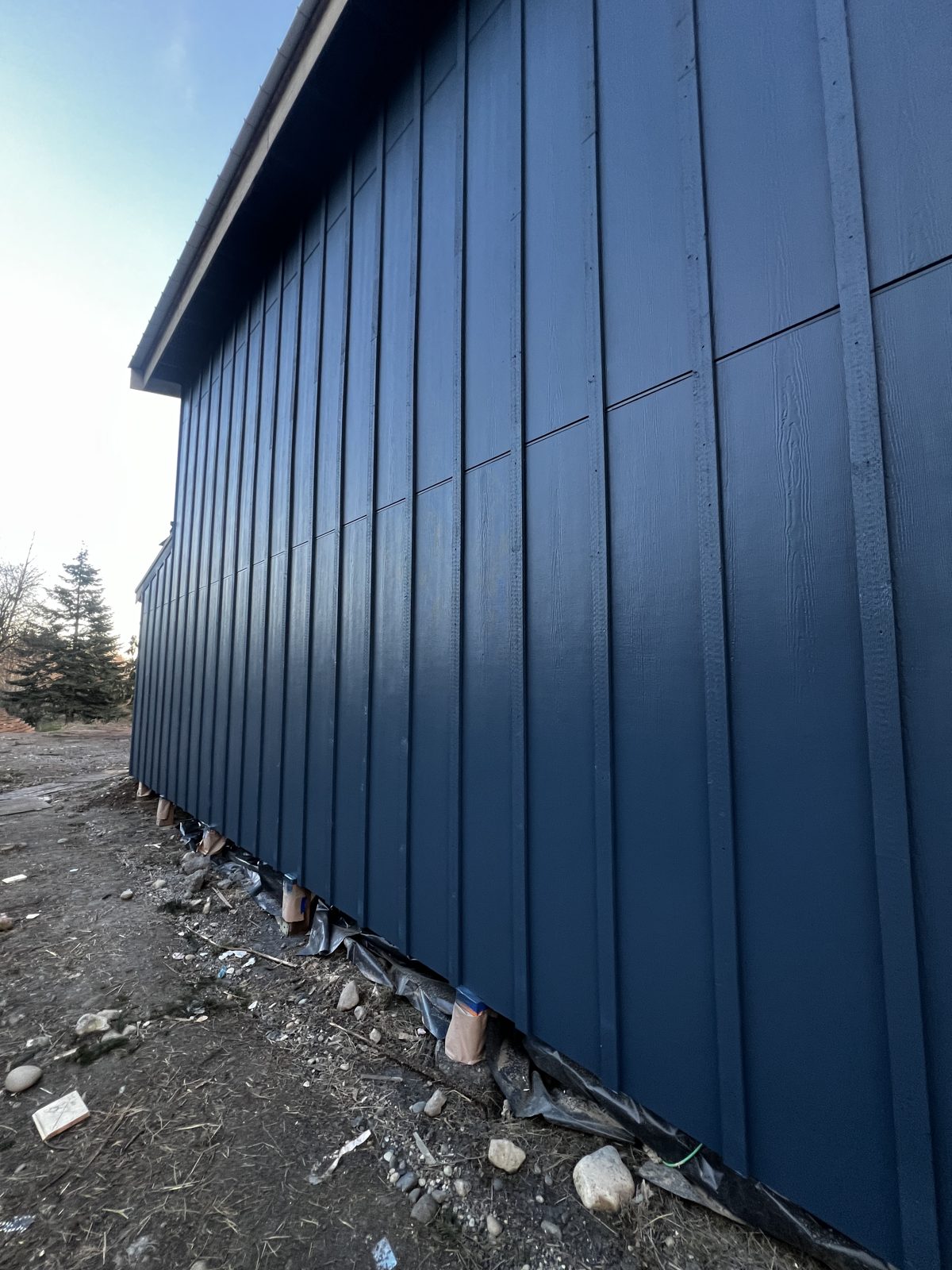 Close-up of navy painted board-and-batten siding