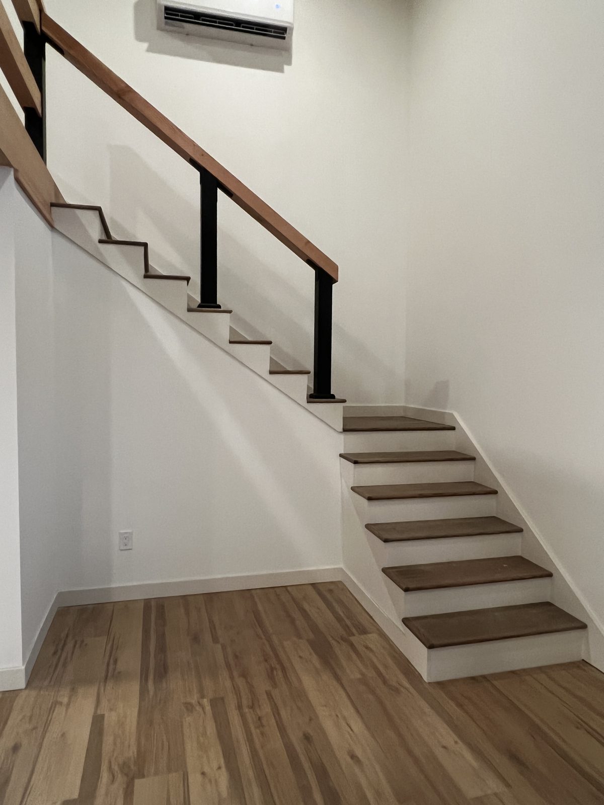 Painted white walls and stair risers inside the Snohomish cabin