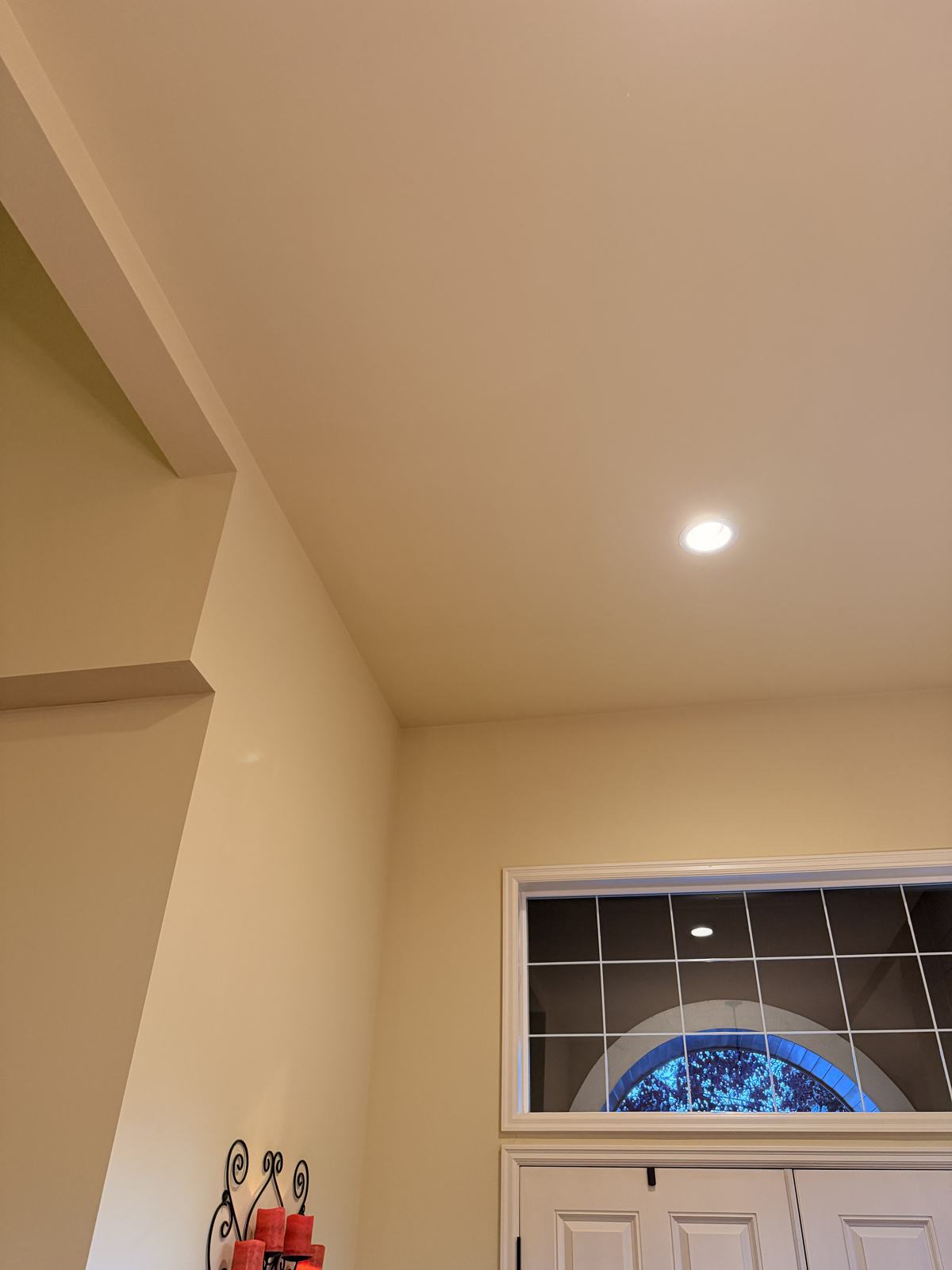 Finished ceiling repair painted to match, with no visible patch