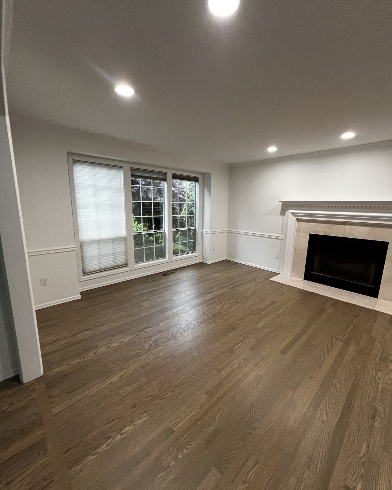 Freshly painted living room with fireplace in a Mill Creek home