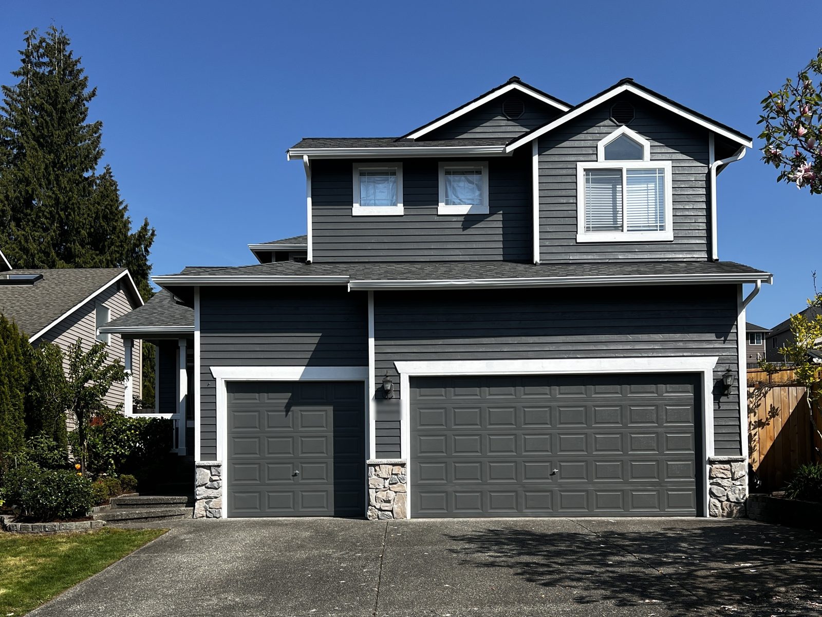 The same Mill Creek home after an exterior repaint in charcoal gray