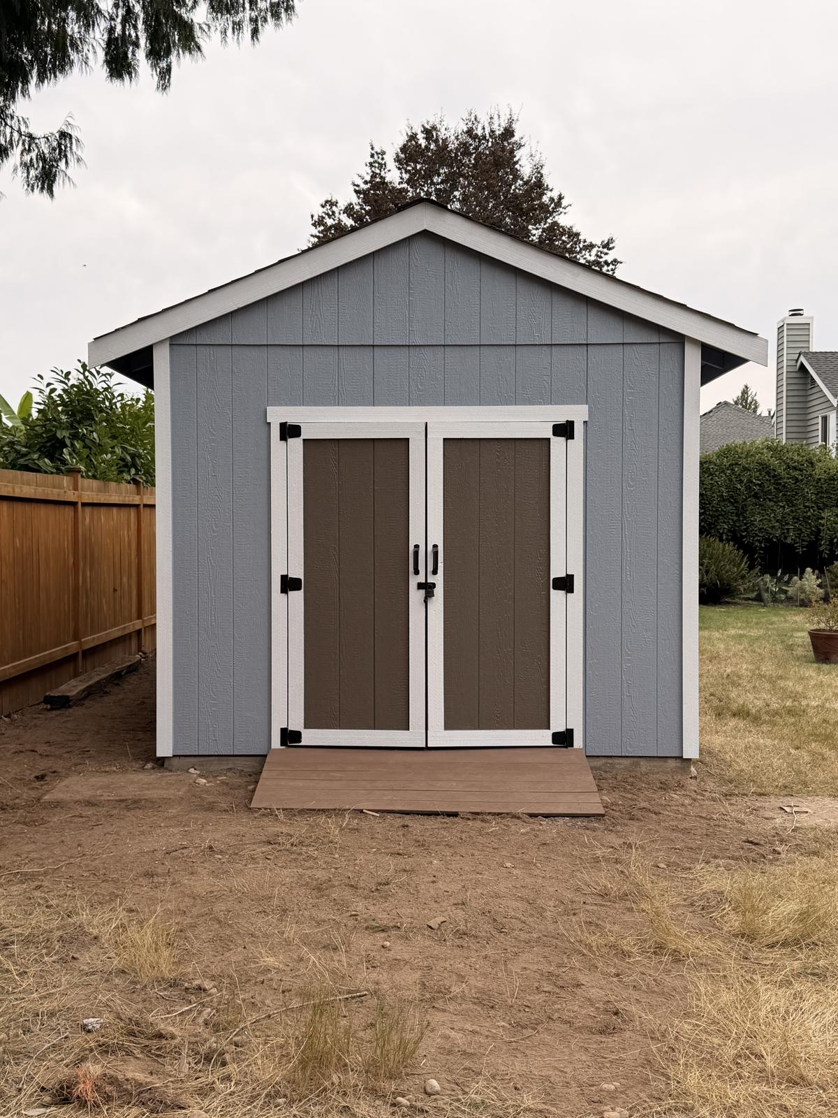 Storage end of the Bothell ADU with brown double doors and white trim