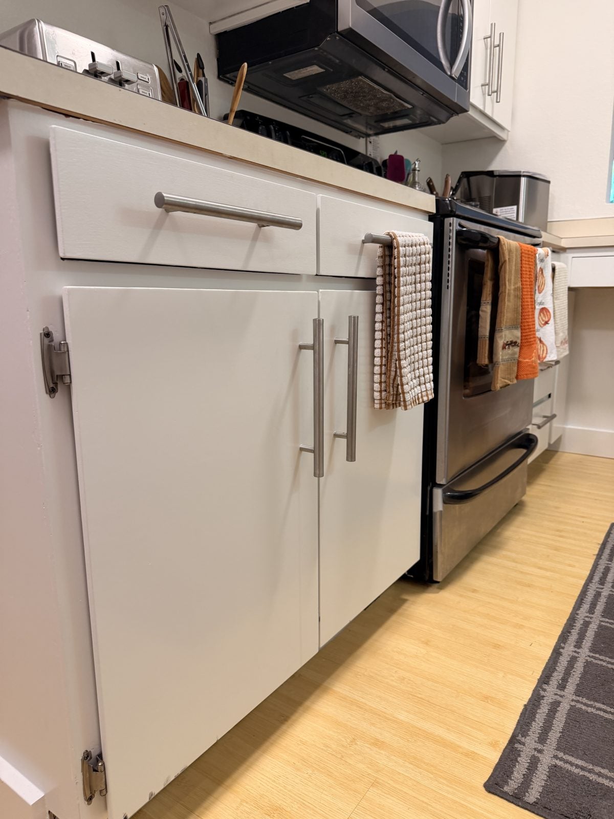Close-up of smooth white painted lower cabinet doors in Edmonds
