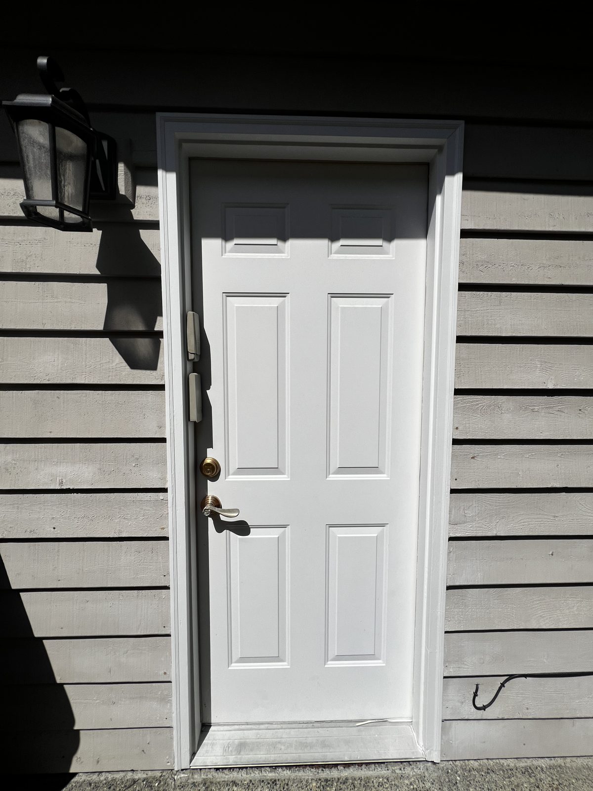 Freshly painted white exterior door and frame