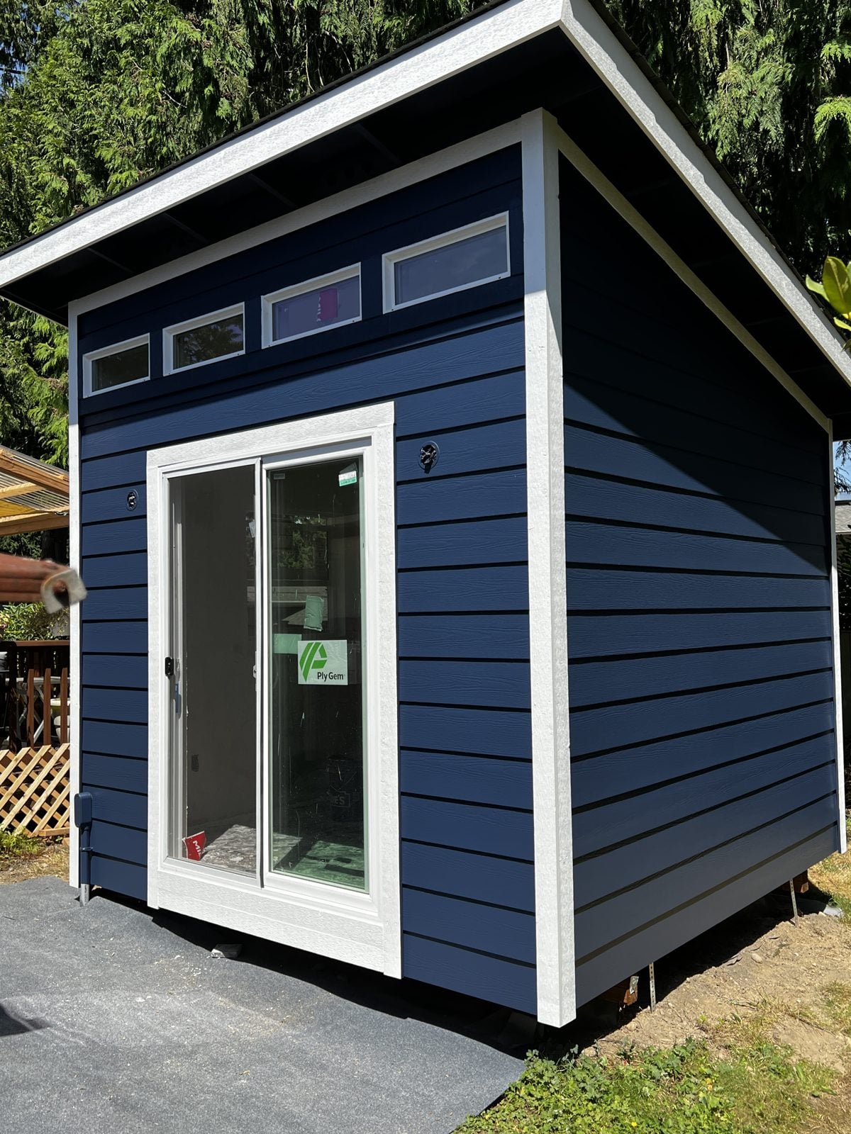 The same studio painted navy with white trim