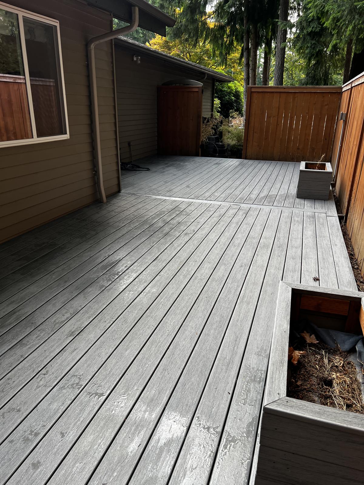 Large backyard deck in Mill Creek refinished in gray