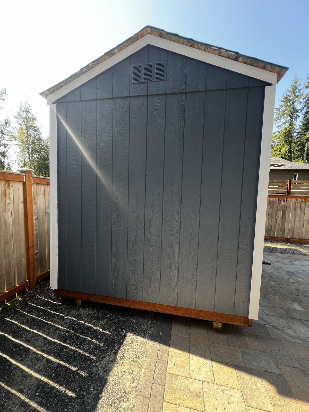 Side of the charcoal Granite Falls shed