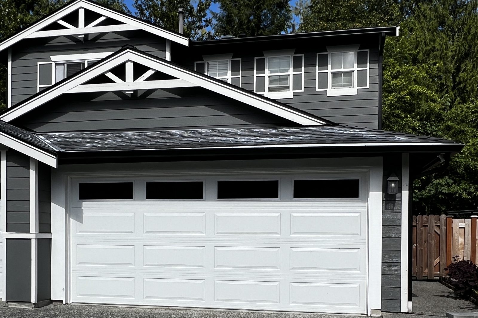 Home with clean white gutters and trim along the roofline