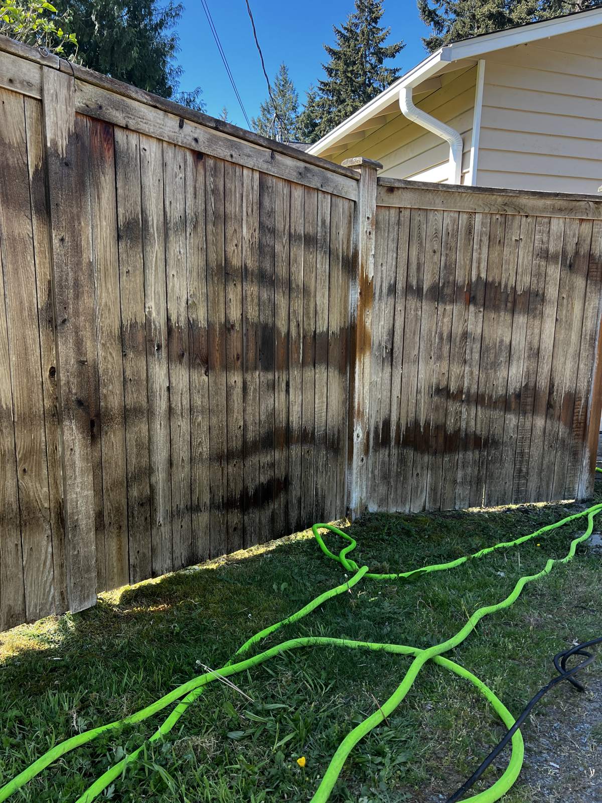 Fence with dark water stains and weathering